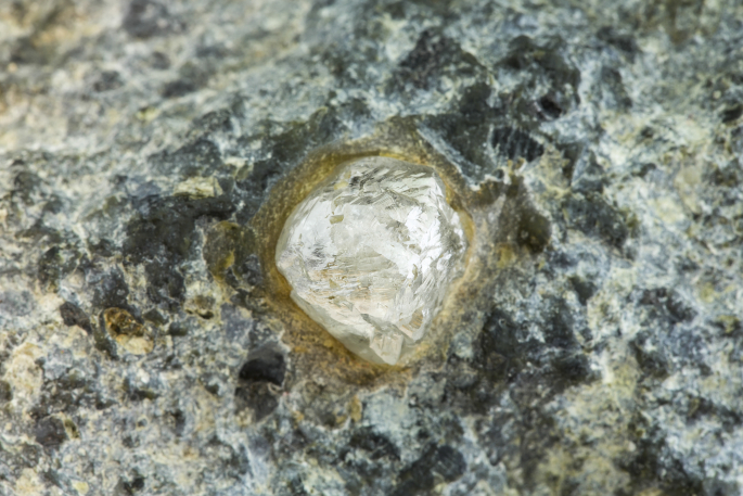 a rough diamond is wedged into others rocks and only shines slightly. It needs polishing to become a real diamond.